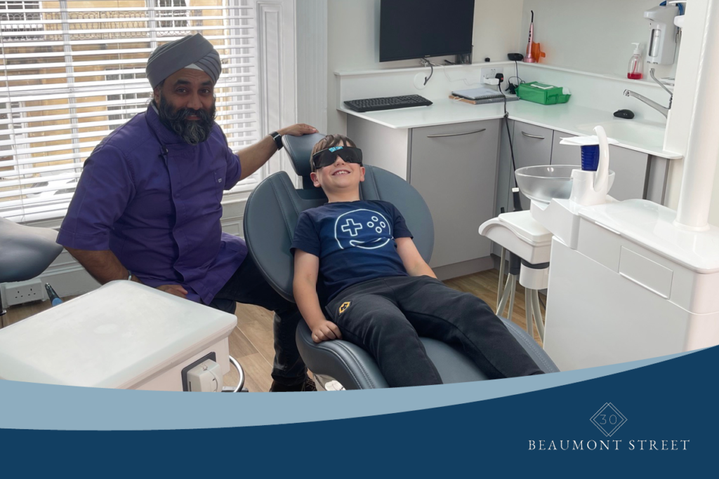 Dr Raj and patient Luke in protective glasses